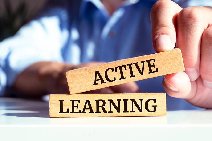 Decorative image of building blocks reading "active learning."